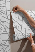 Boutique silk fabric wallpaper, featuring a watery silver branch design, covers an area up to 4.2m x 3m and includes adhesive and a smoothing tool.